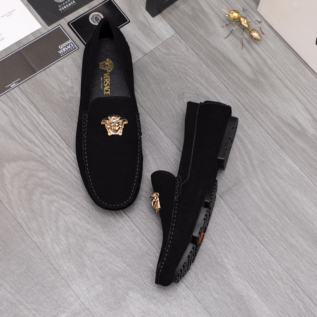 Black suede loafers with gold Medusa crest and thick rubber sole