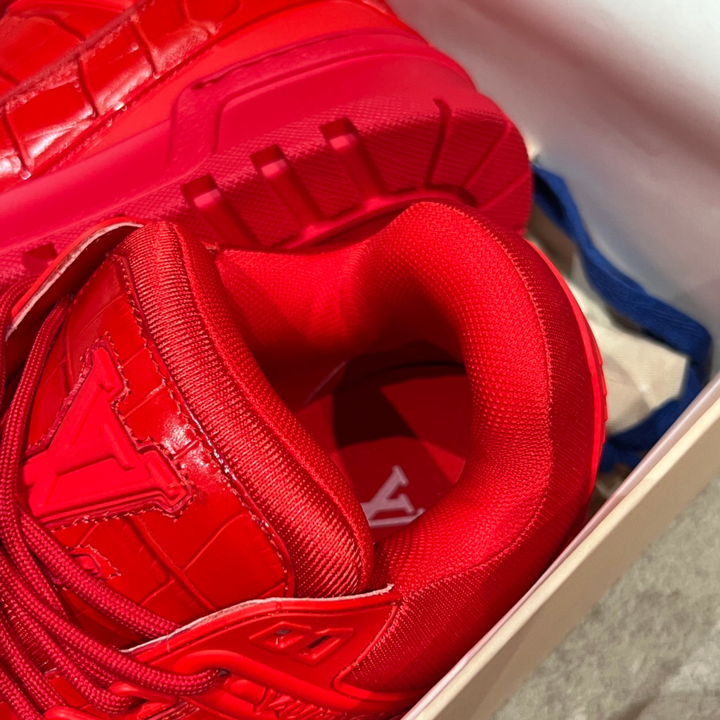 Louis Vuitton red trainer sneaker close-up of insole and lace-up interior