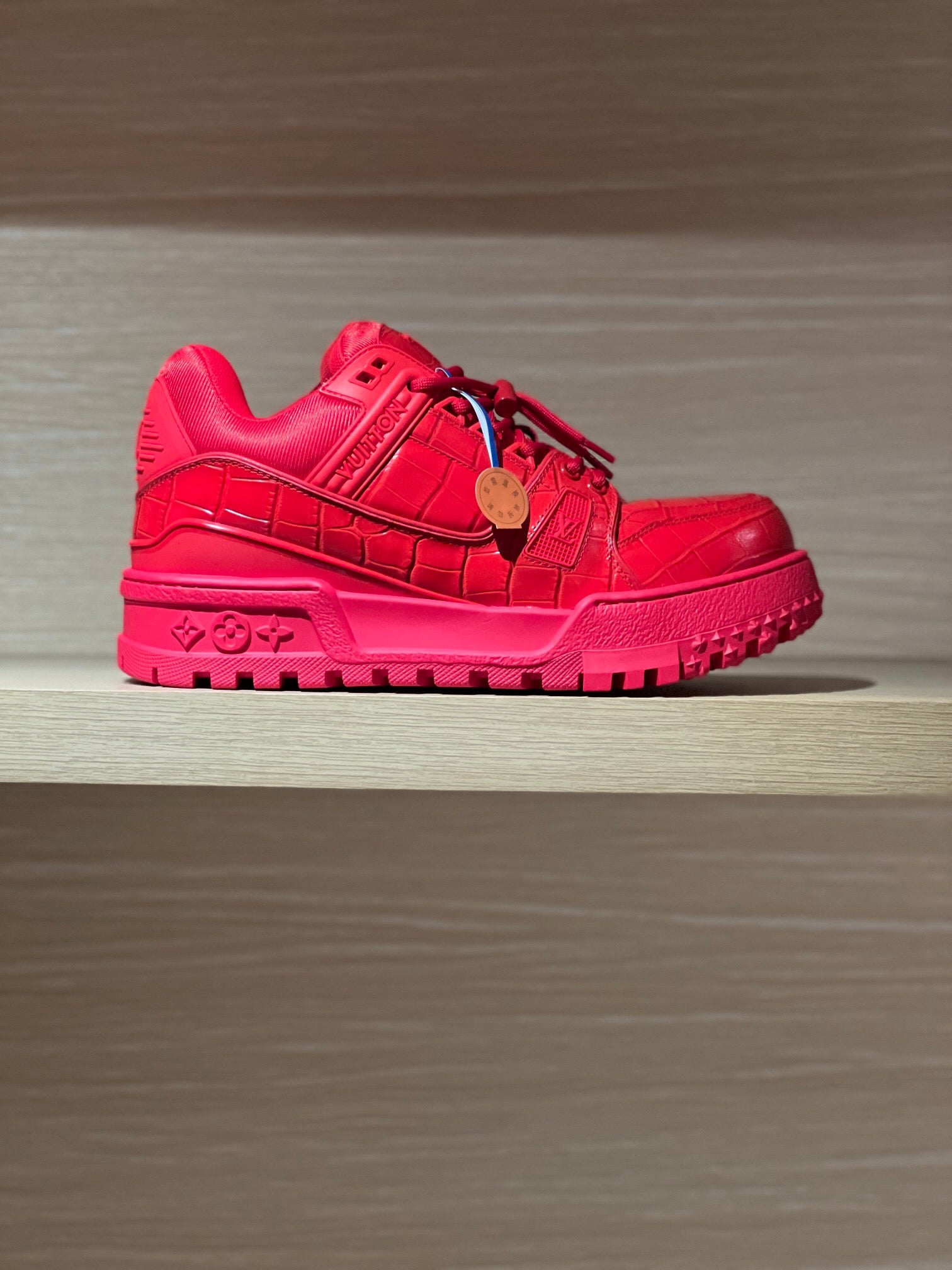 Louis Vuitton red trainer sneakers with lace-up closure and chunky treaded sole