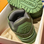 Green and gray trainer sneaker heel with textured outsole tread and embossed logo