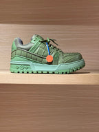 Green leather trainer sneaker with LV logo, lace-up front and chunky rubber sole