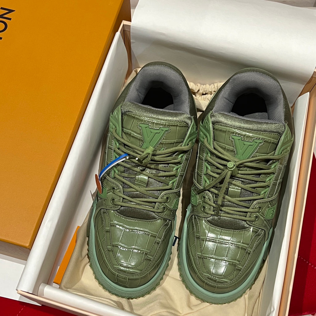 Green leather trainer sneakers in box, lace-up front with brand tongue logo