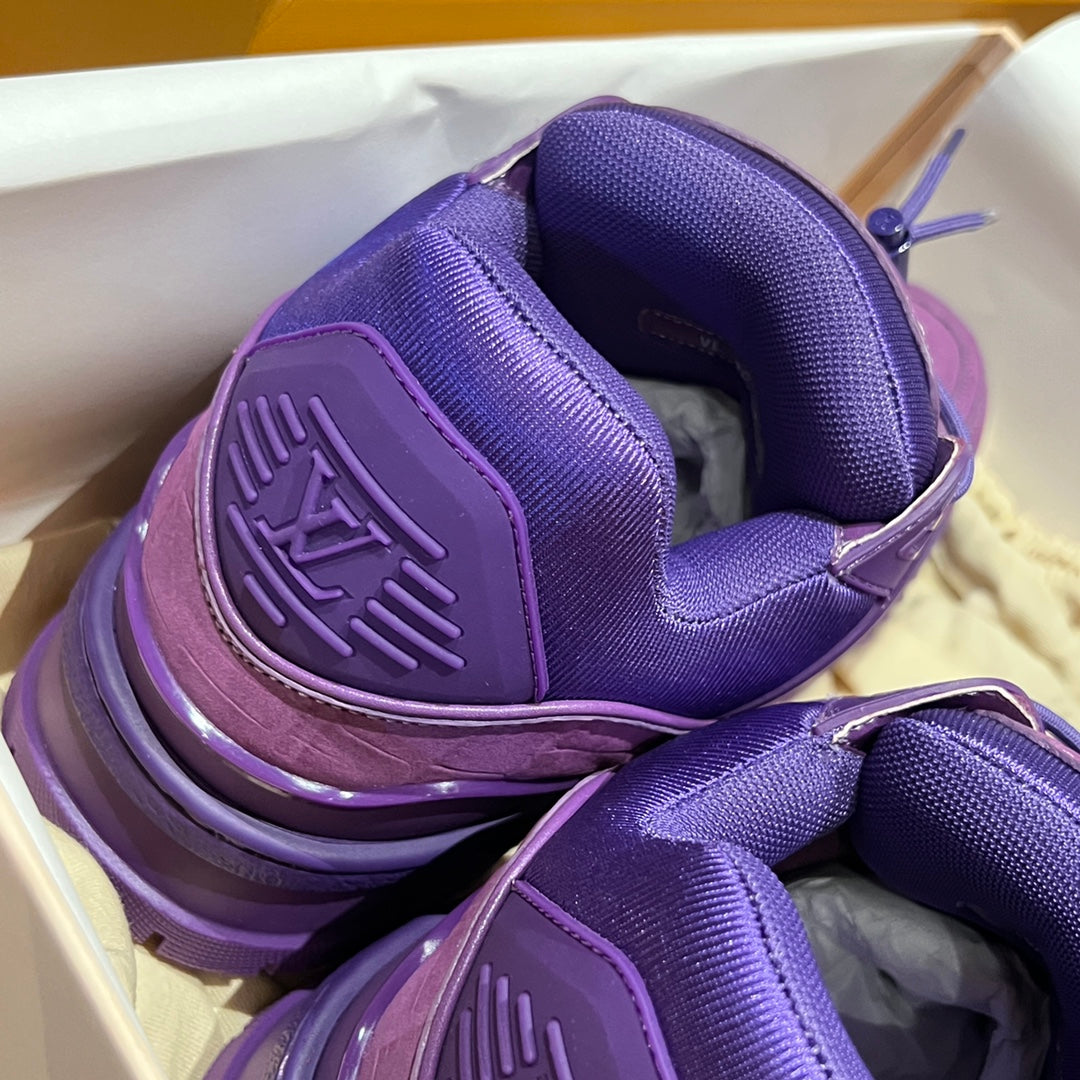 Purple Louis Vuitton trainer shoes from the heel, showing cushioned collar and logo patch