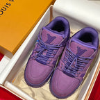 Pair of purple Louis Vuitton trainer shoes in a box with lace-up front and logo