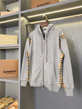 Hooded zip-up sweatshirt in heather gray with plaid sleeve panels and front zipper