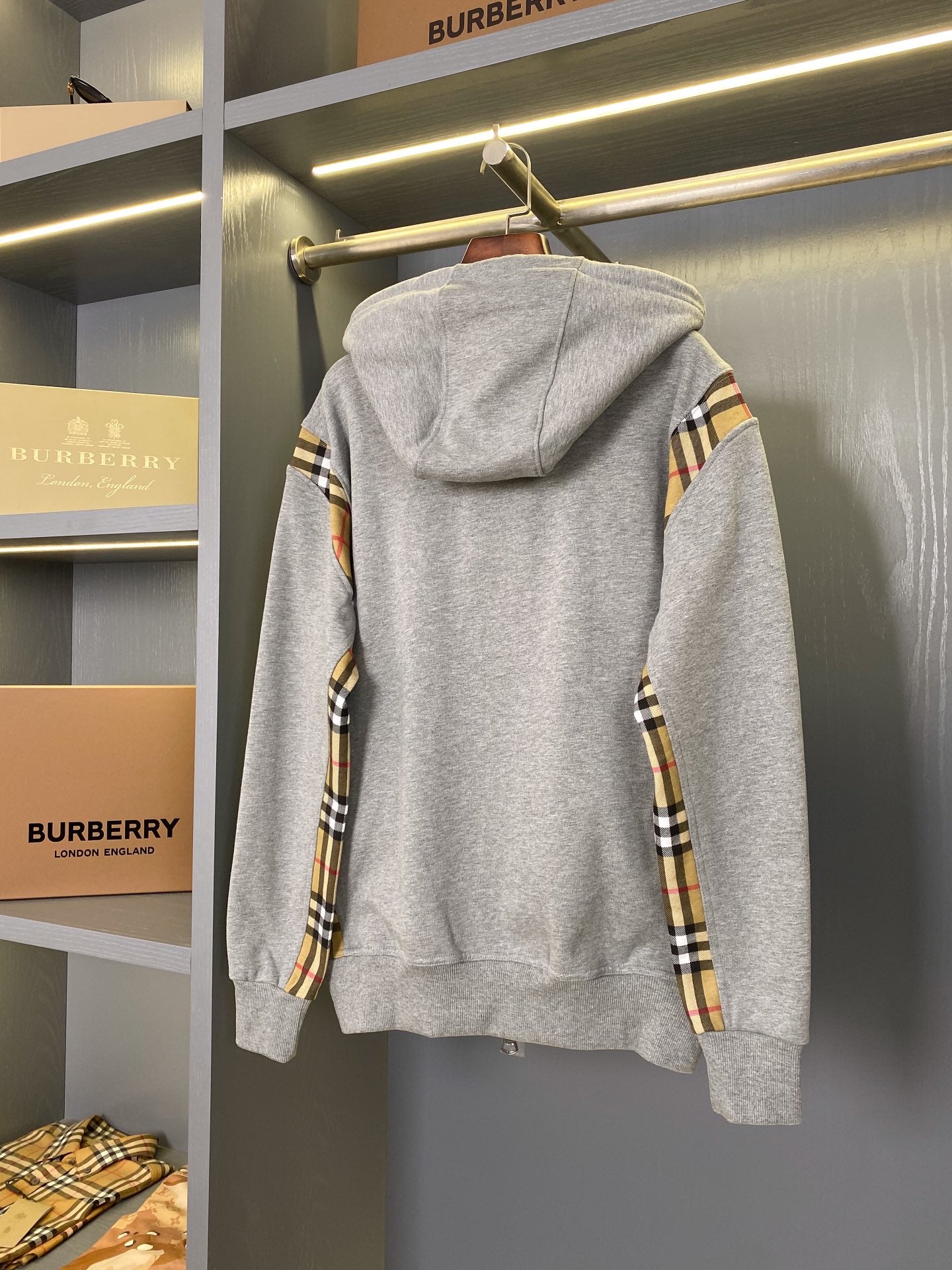 Heather gray zip-up hoodie with back hood and plaid sleeve panels