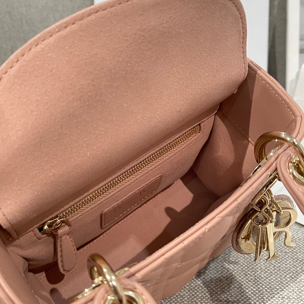 Dior mini handbag interior pocket with zipper and gold-tone hardware, light pink leather
