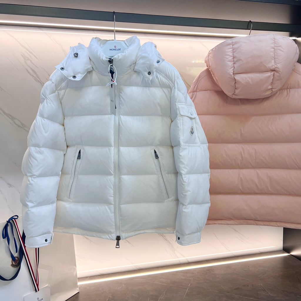 Light blue and pale pink long puffer jackets with hood, shown from front