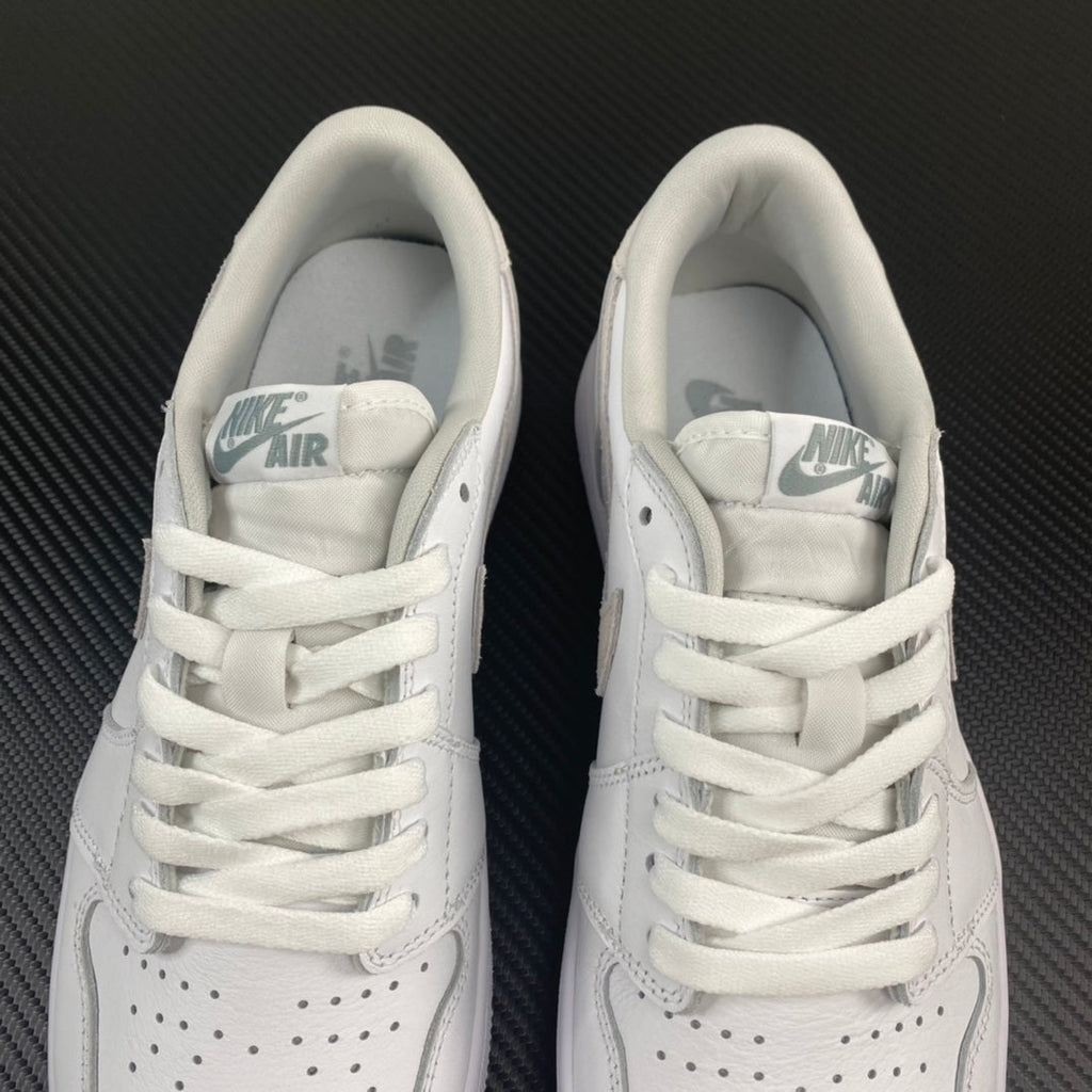 Air Jordan 1 low OG sneakers, inner collar view with Nike Air tongue label