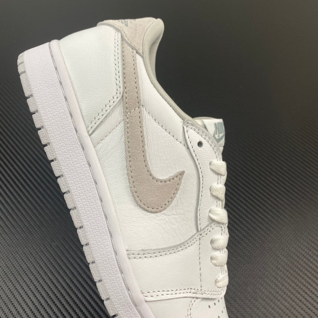 Air Jordan 1 low OG sneakers, side view with light gray wing logo and white laces