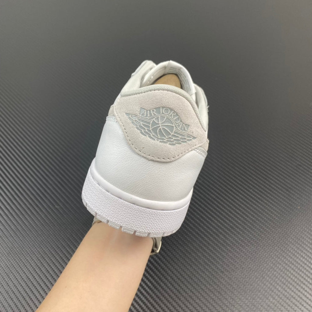 Air Jordan 1 low OG sneakers, heel view with Nike Air logo on white upper