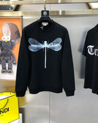 Black crewneck sweatshirt with blue dragonfly graphic and drippy details