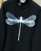 Black crewneck sweatshirt with detailed blue dragonfly graphic on chest
