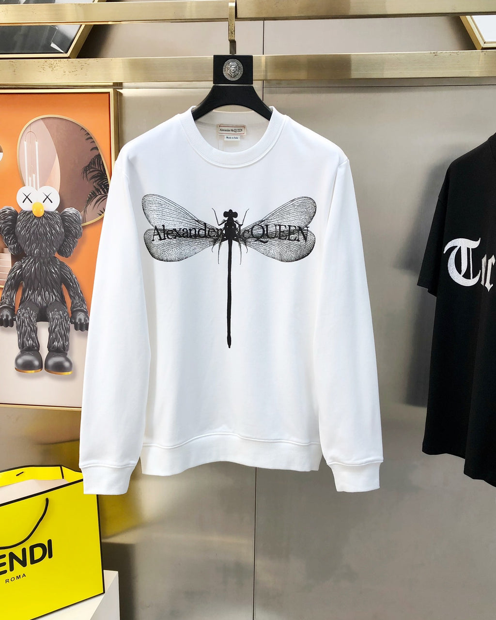 White crewneck sweatshirt with large dragonfly graphic on chest