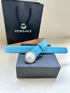 Turquoise leather belt with circular silver medallion buckle and adjustable hole rows