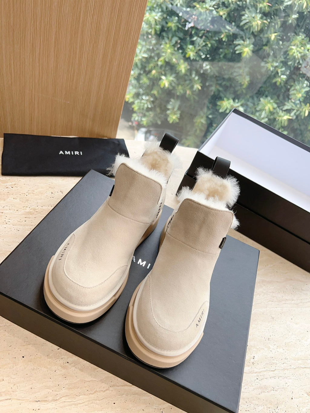 Amiri matching pair of ankle boots in light beige suede with faux fur trim and rubber sole