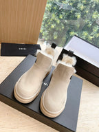 Amiri matching pair of ankle boots in light beige suede with faux fur trim and rubber sole