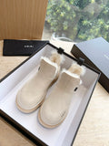 Amiri ankle boots in light beige suede with faux fur trim and thick rubber sole