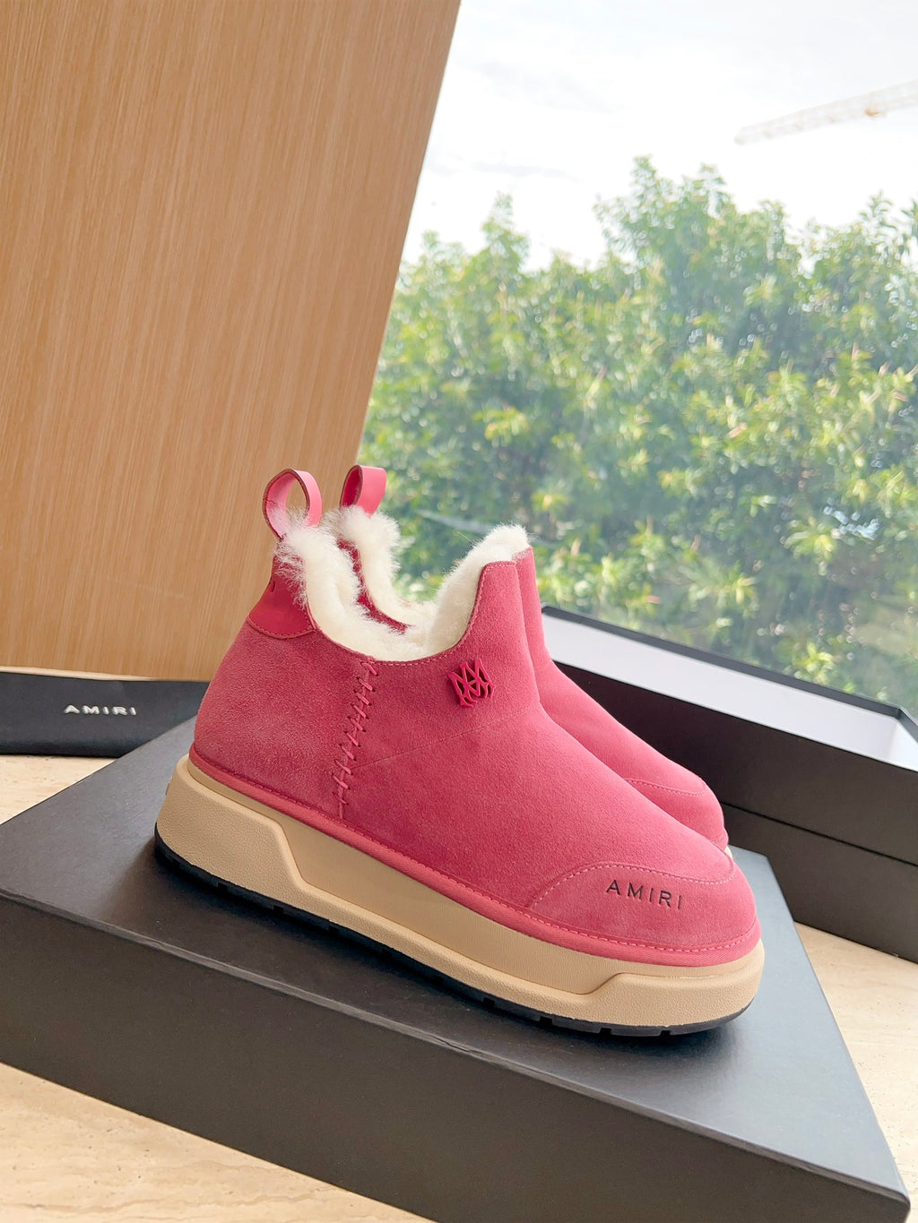 Pink suede Chelsea boot with faux shearling lining and beige platform sole