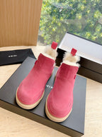 Pink suede Chelsea boots with faux shearling trim and cushioned beige sole