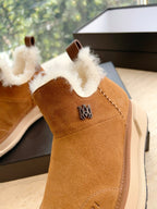 Amiri tan suede ankle boot with white shearling collar and crest emblem