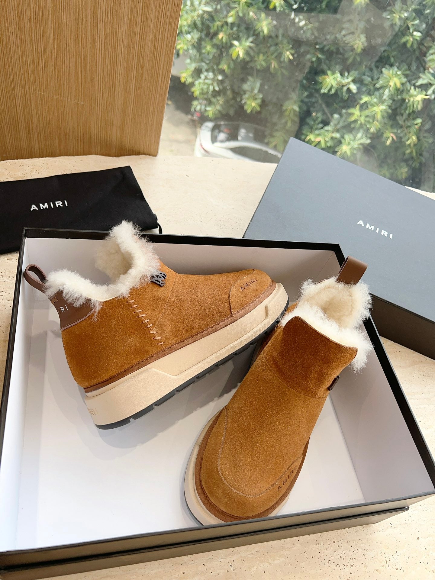 Amiri tan suede ankle boots with white shearling strap detail, boxed pair