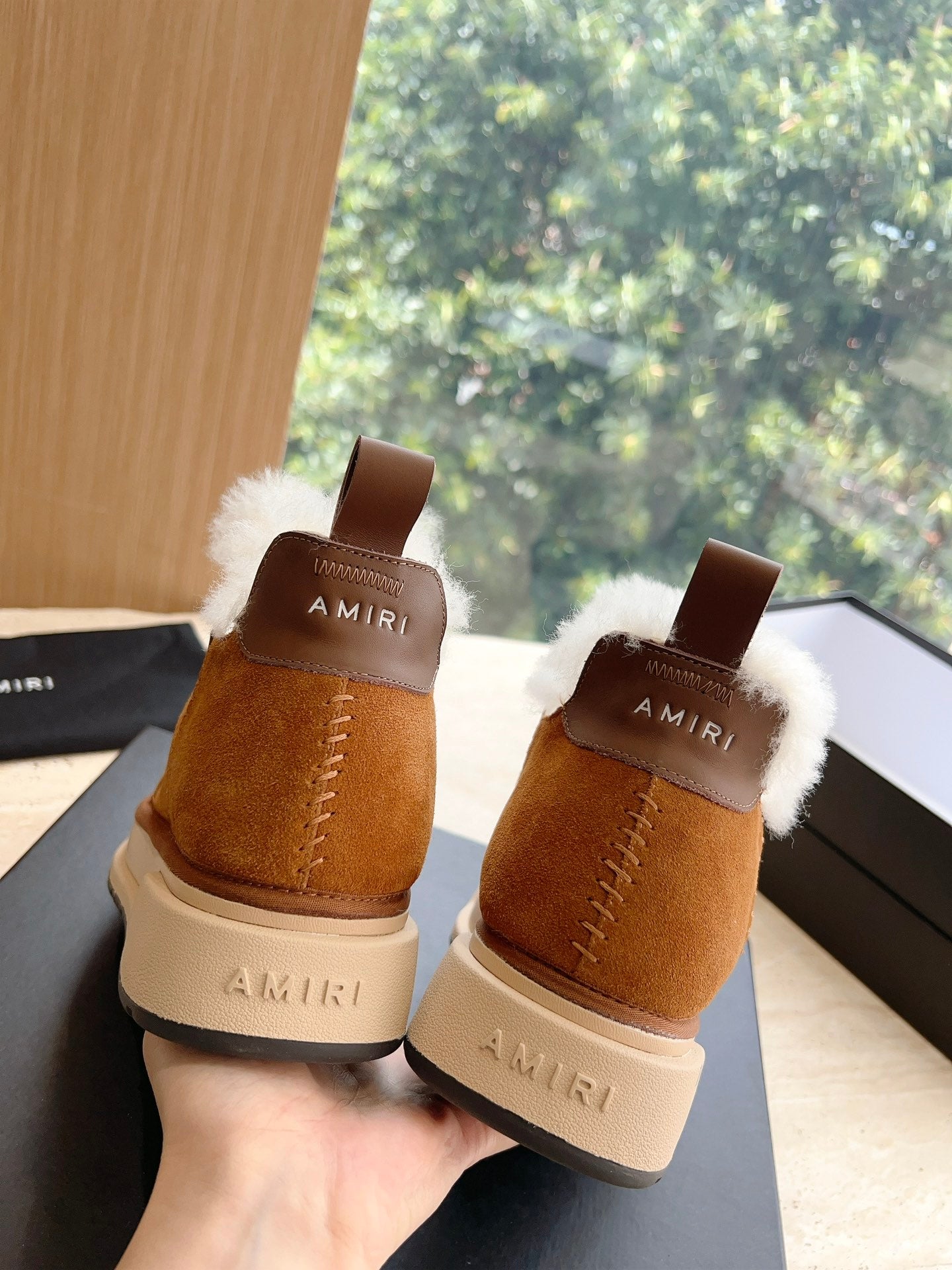 Amiri tan suede ankle boots with white shearling collars, heel view