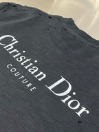 Christian Dior Couture logo graphic on dark T-shirt fabric