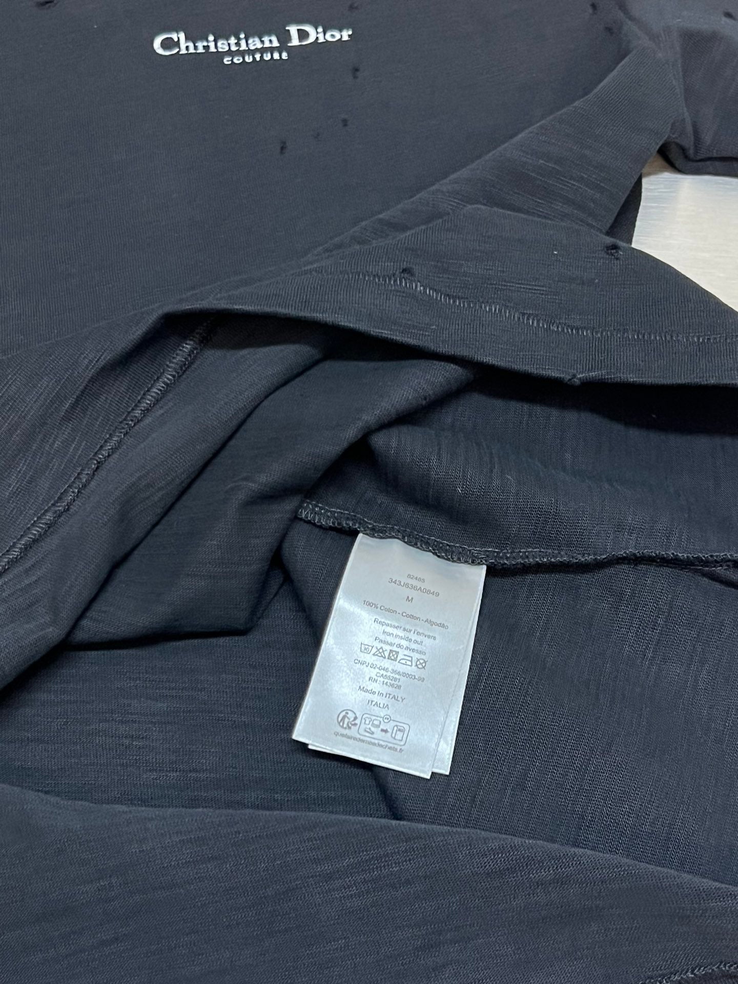 Christian Dior T-shirt interior with care label and folded fabric