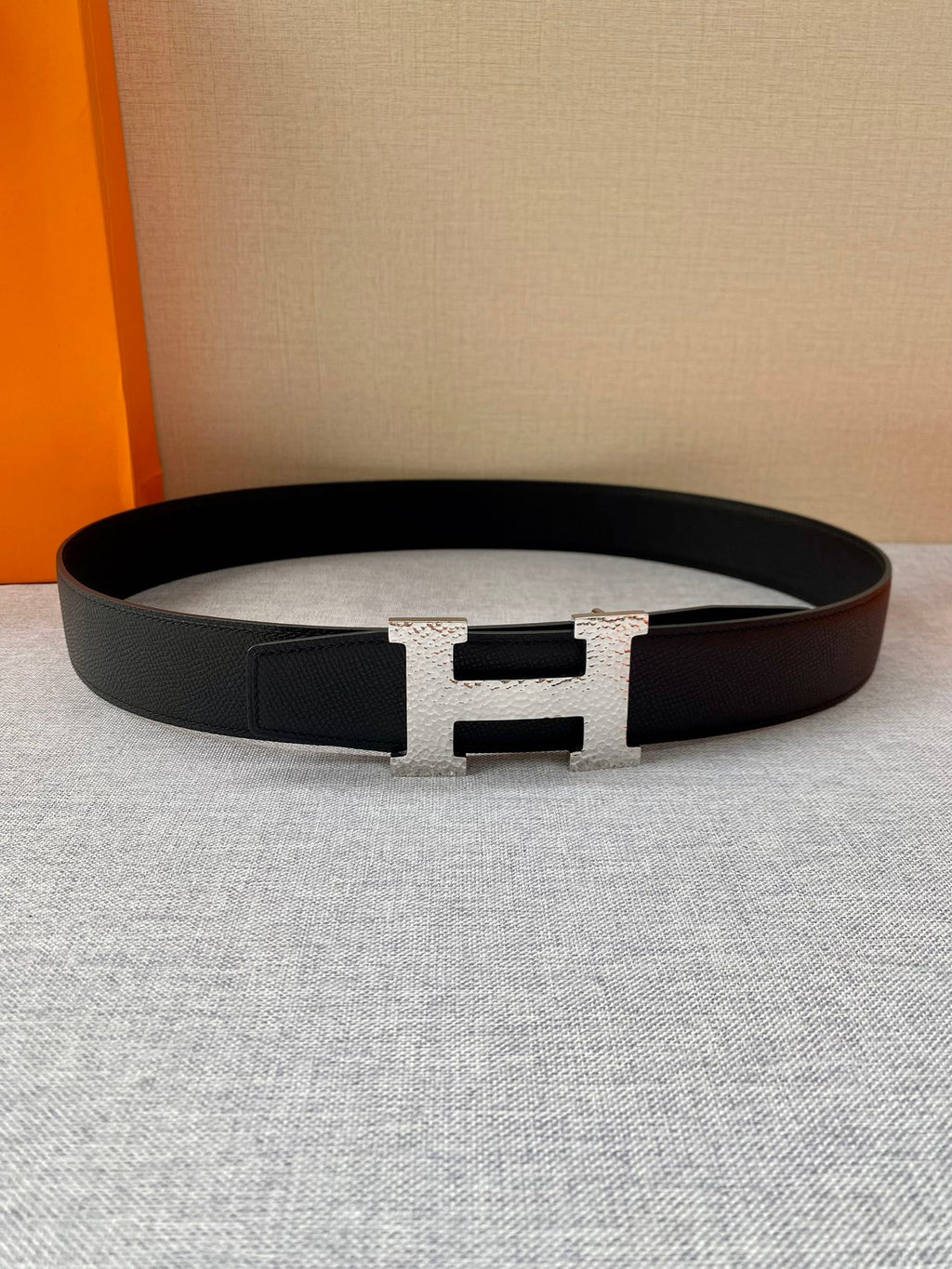 Hermes belt on fabric: black strap with gold H buckle and keeper