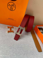 Red leather belt with gold-tone H buckle and red keeper strap