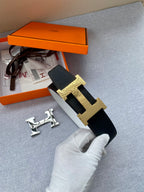 Black leather belt with gold-tone H buckle and included strap end hardware