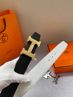 Black leather belt with gold-tone H buckle, flat strap and keeper holes