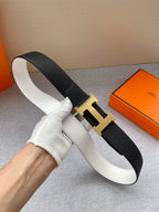 Black leather belt with gold-tone H buckle, shown from side angle