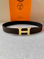 Hermes leather belt with dark strap and gold H buckle