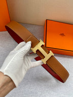 Hermes leather belt in tan/brown with gold H buckle and red lining