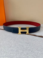 Navy leather belt with gold-tone H buckle and red inner lining