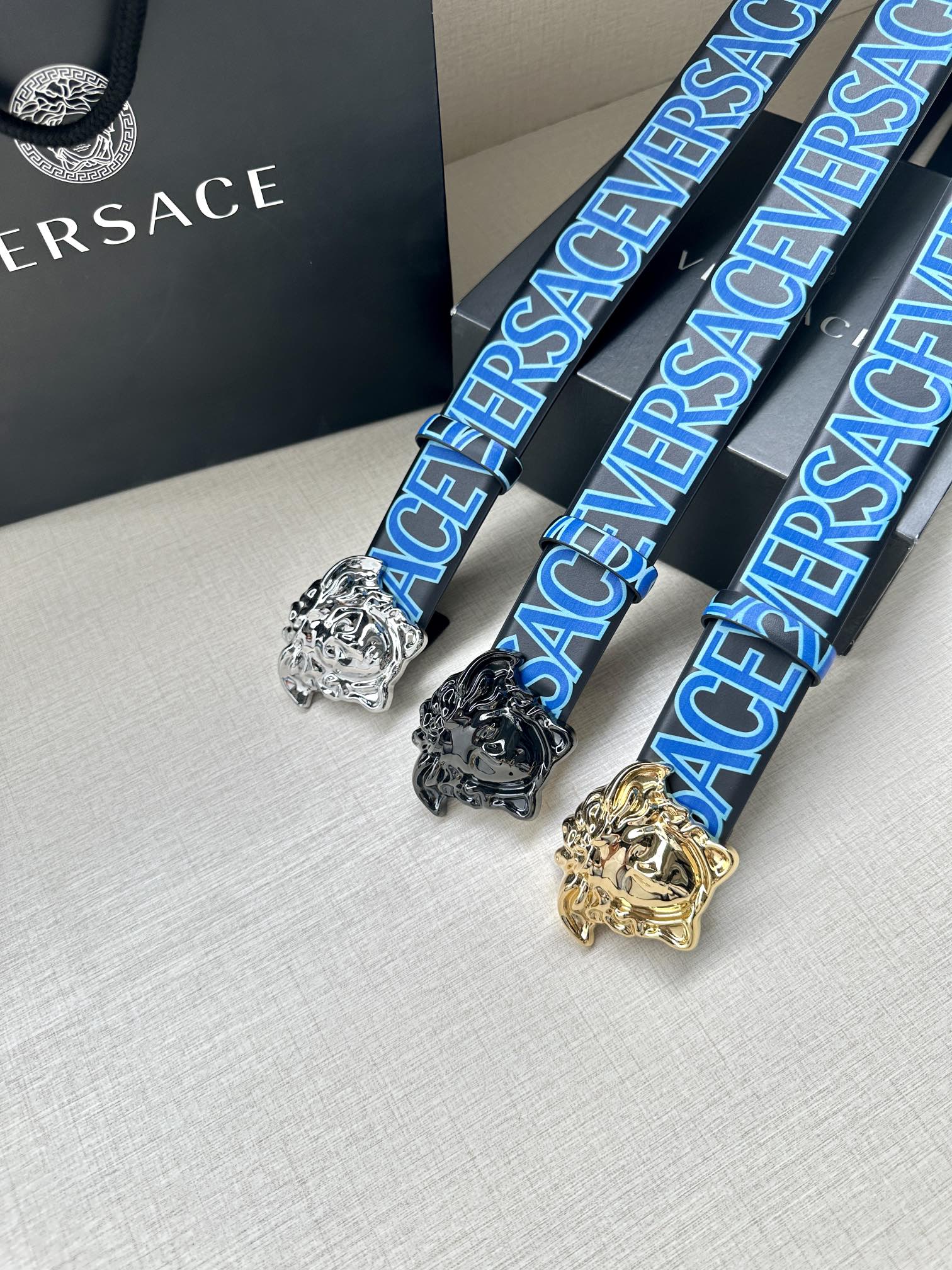 Versace belt trio with blue logo webbing and Medusa buckles in silver, black, and gold