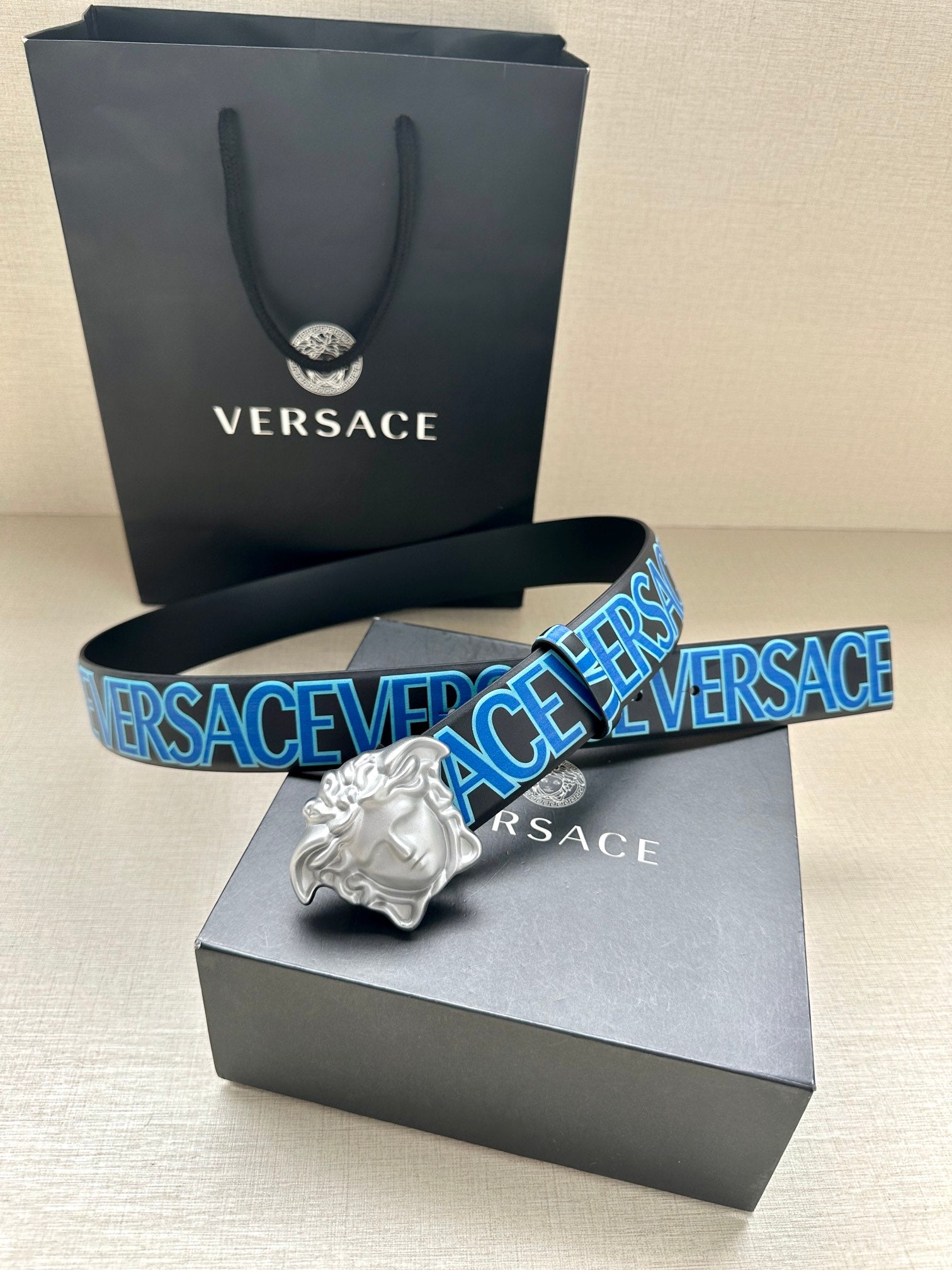 Versace belt with blue logo webbing strap and silver Medusa head buckle