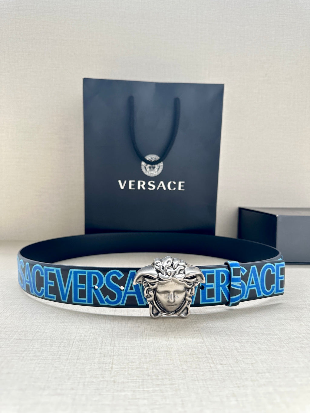 Versace belt: blue logo strap with silver Medusa buckle