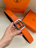 Hermes belt with orange leather strap and silver H buckle, single strap and keeper.