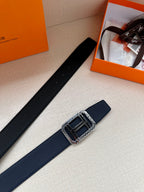 Navy leather belt with silver square buckle, shown angled on display