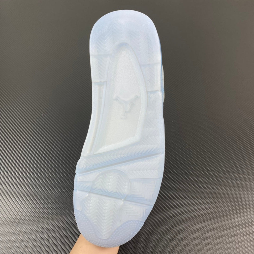 White Air Jordan 4 sneaker outsole tread and heel details