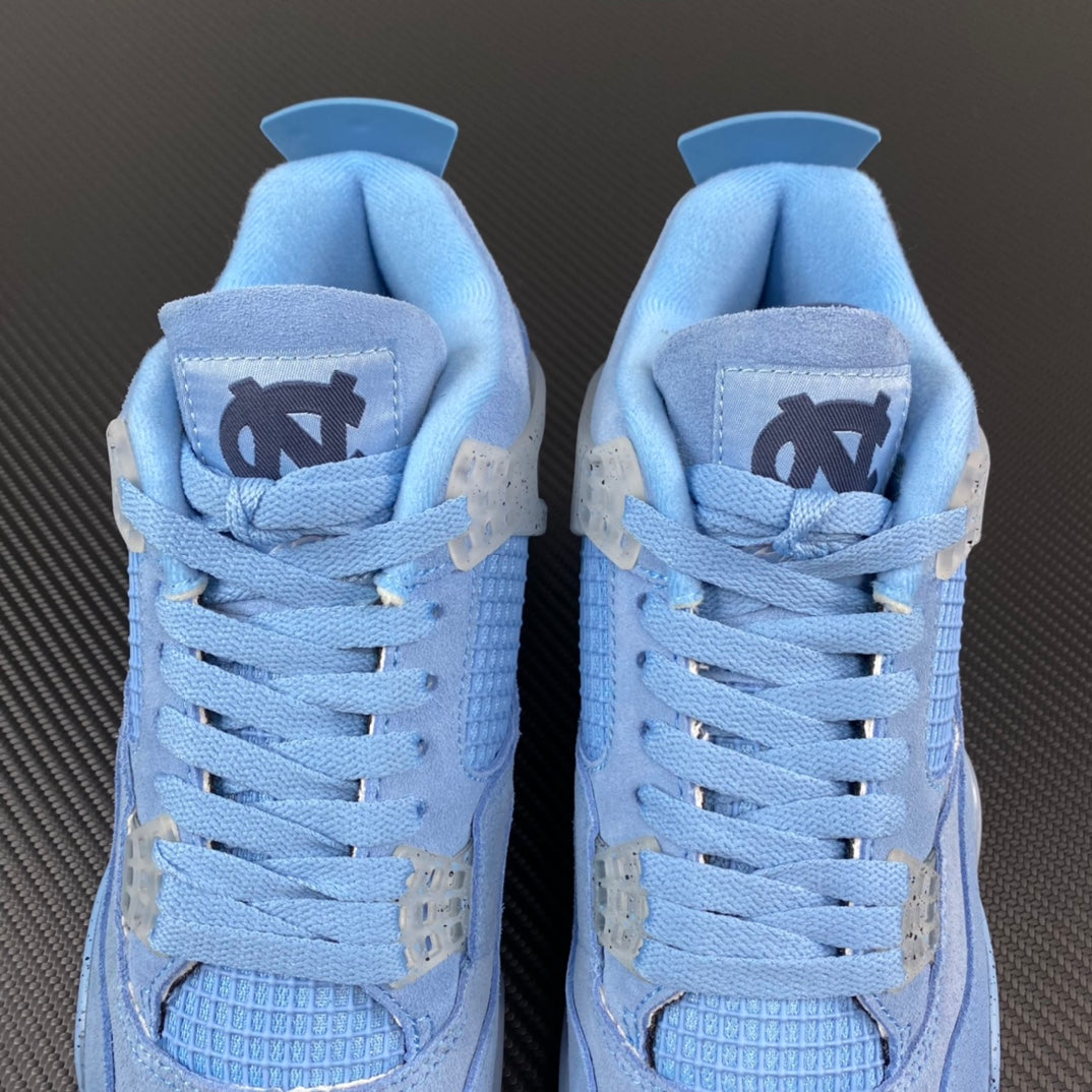 Pair of light blue Air Jordan 4 sneakers front view with winged logo