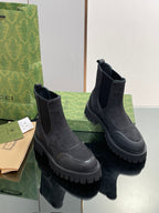 Gucci unisex Chelsea boots, dark embossed pattern, elastic side panels, chunky sole