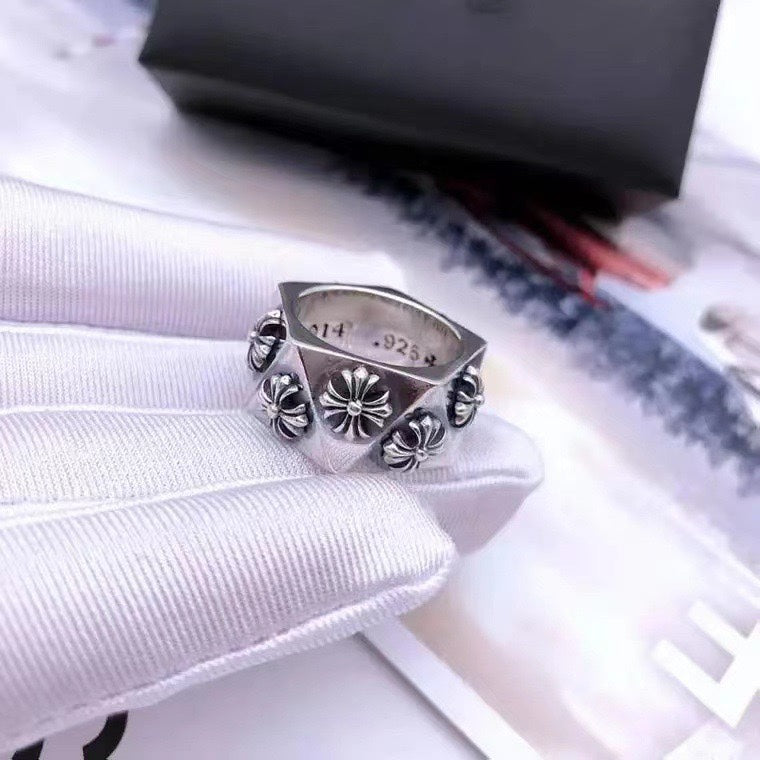 Silver statement ring with floral scroll embossing, adjustable band