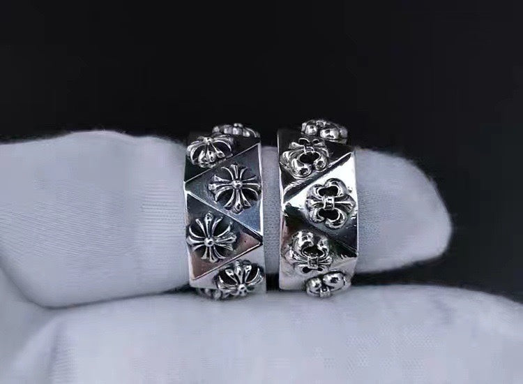 Pair of silver-tone cuff rings with engraved floral and quatrefoil motifs