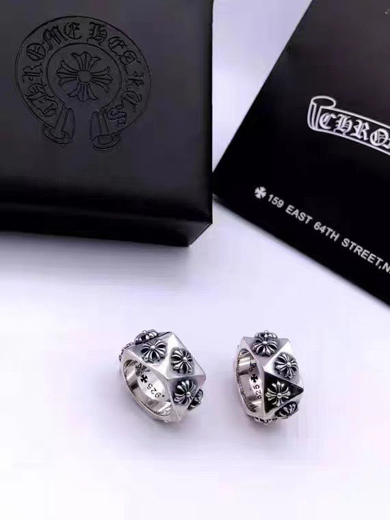 Silver-tone hoop earrings with engraved floral quatrefoil motifs