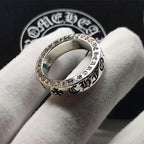 Chrome ring with engraved text and cross pattern, polished silver tone