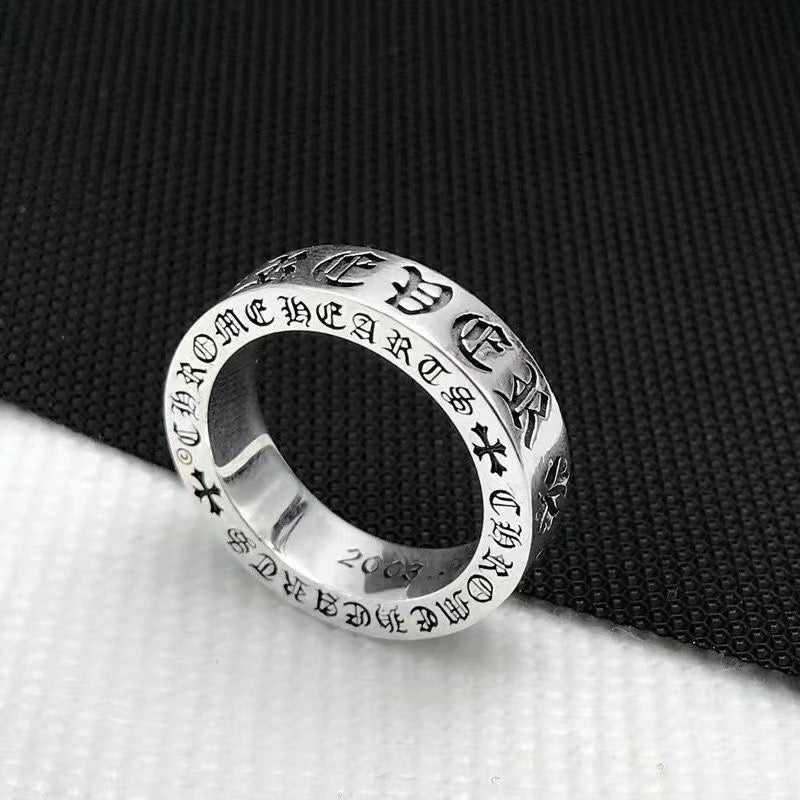 Chrome ring with engraved pattern and cross motifs, polished silver band